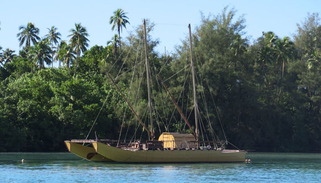 Double-hulled traditional Vaka at Avana Passage. Credit cook islands travel