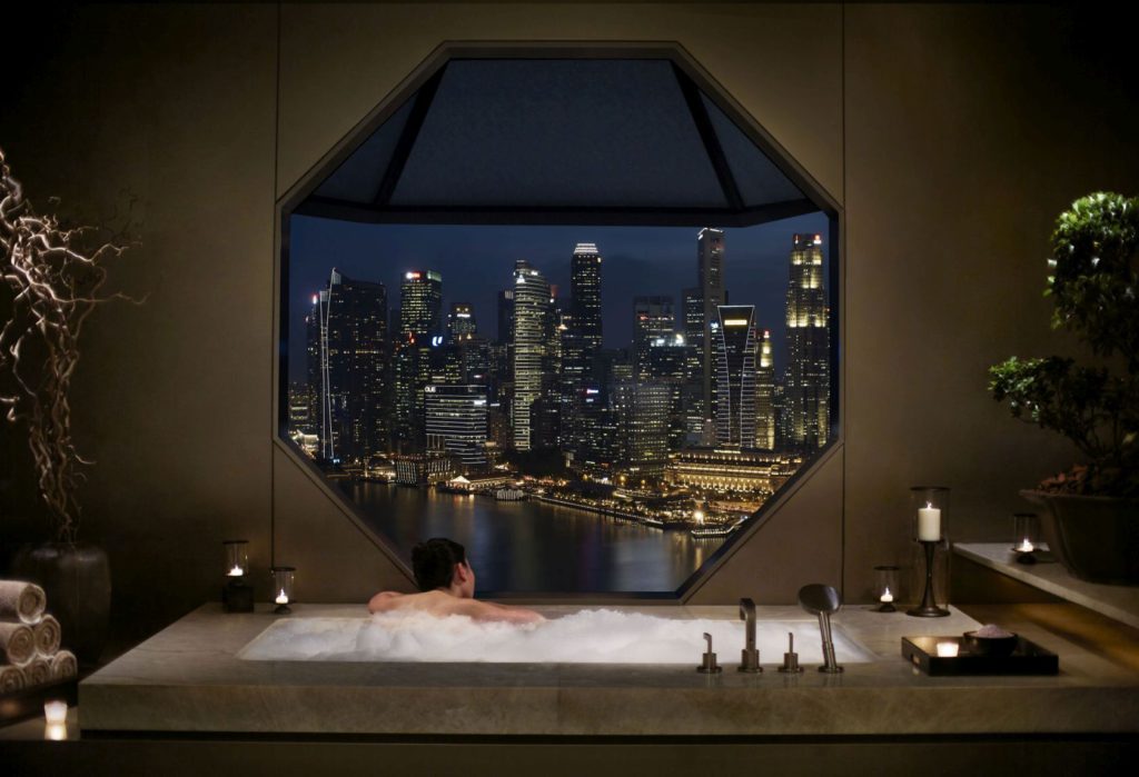 Bathtub indulgence in a  suite at The RitzCarlton Millennia Singapore.